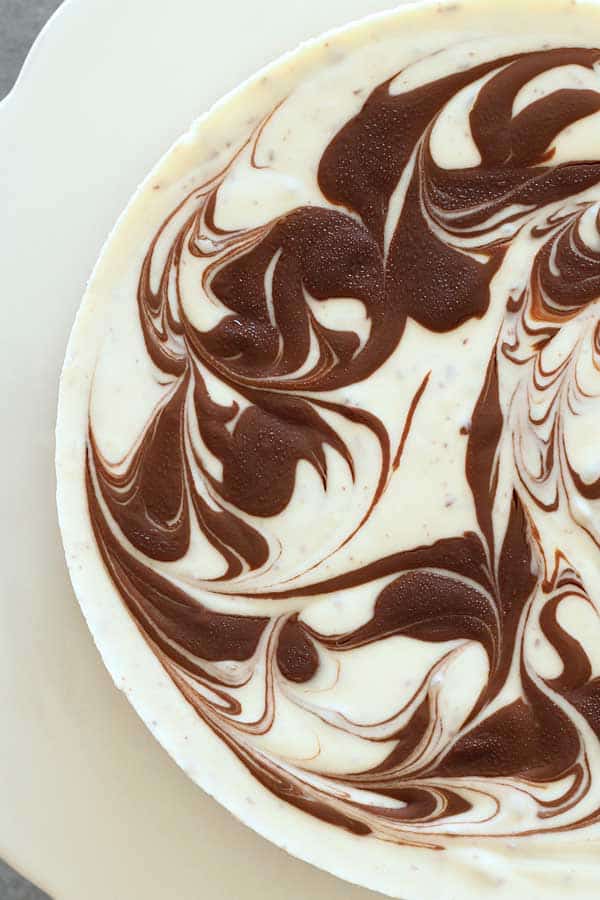 top view of no bake stracciatella cheesecake showing swirl chocolate decoration