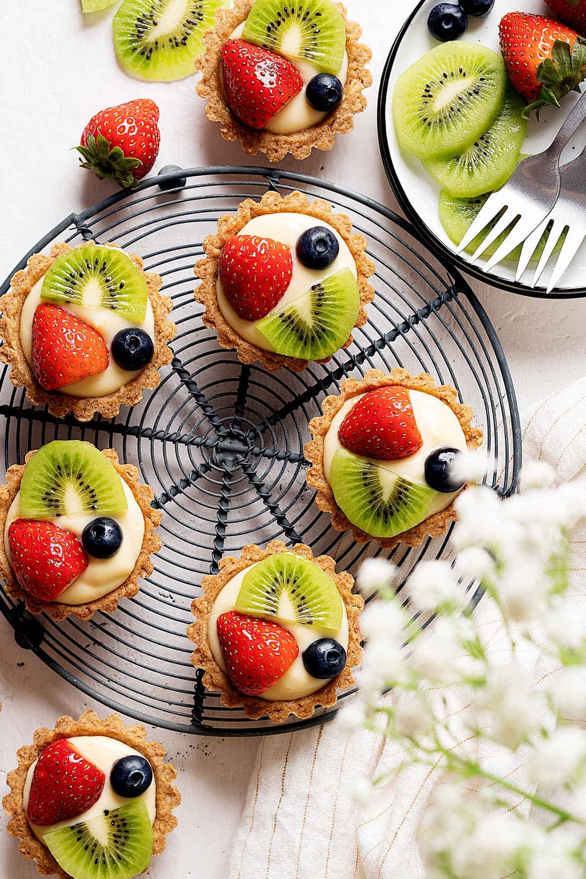 Healthier fruit tarts on a rack view from top